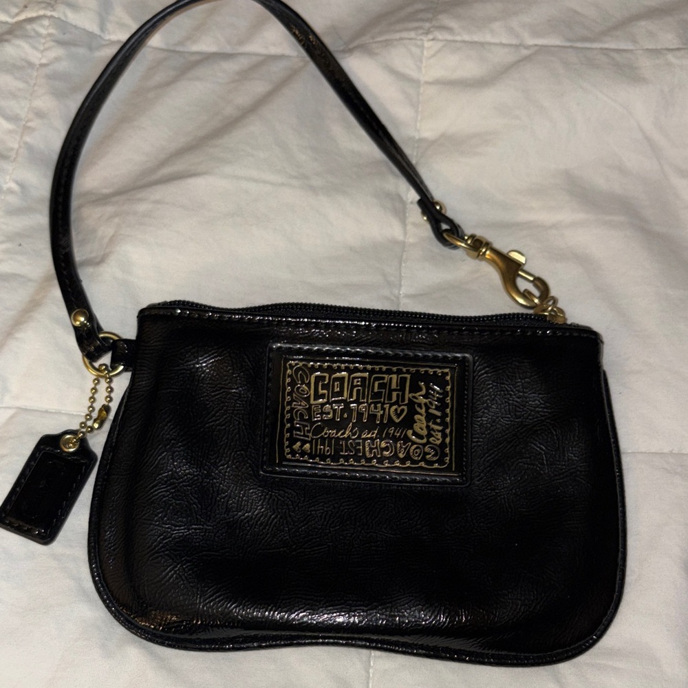 Coach Black Leather Wristlet with black and Gold Plaque